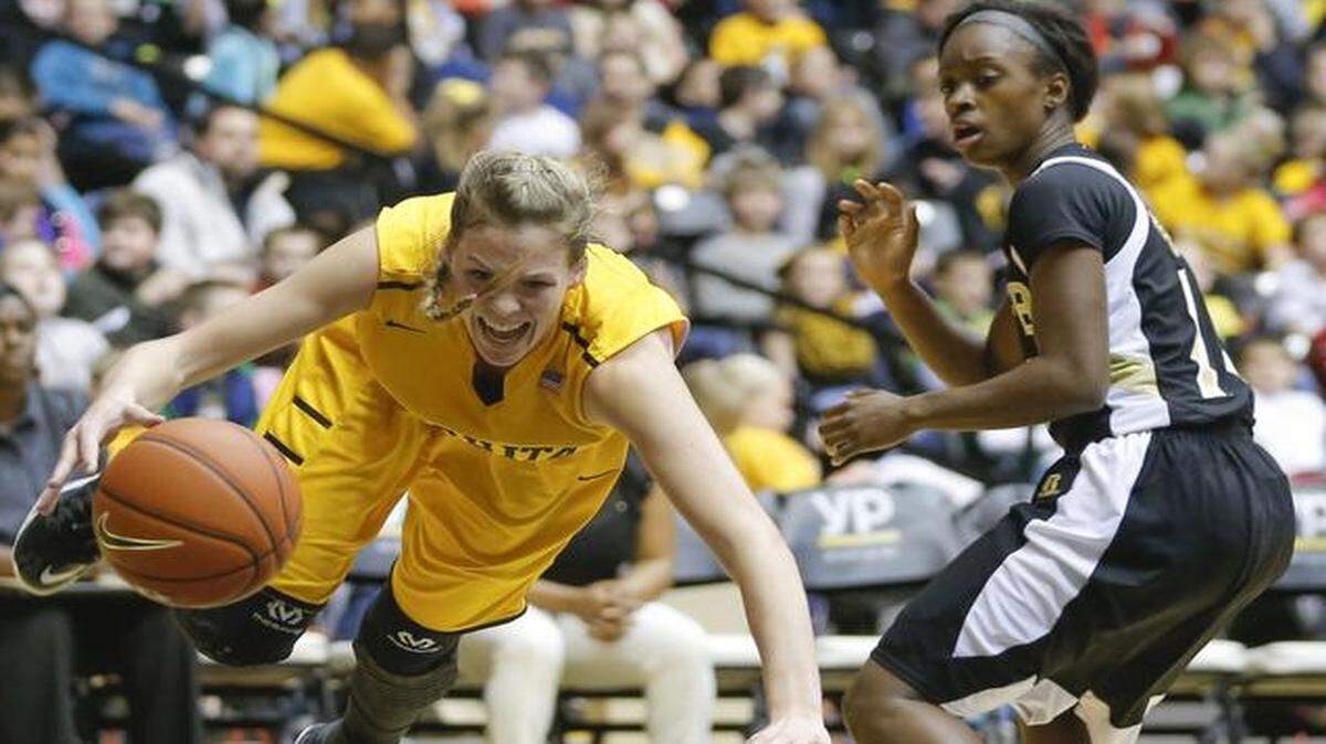 
Wichita State’s Kelsey Jacobs gets tripped up while driving to the basket against Arkansas-Pine during the first half on Friday at Koch Arena.
