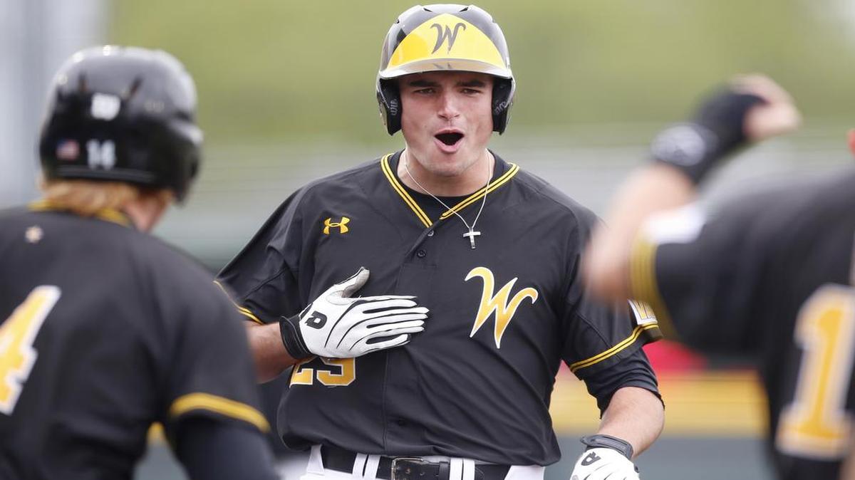 
Wichita State’s Sam Hilliard scores a run against New Mexico in the fifth inning Sunday at Eck Stadium. Hilliard tripled — his second triple of the game — and continued home after a throwing error, putting WSU ahead 6-5.
