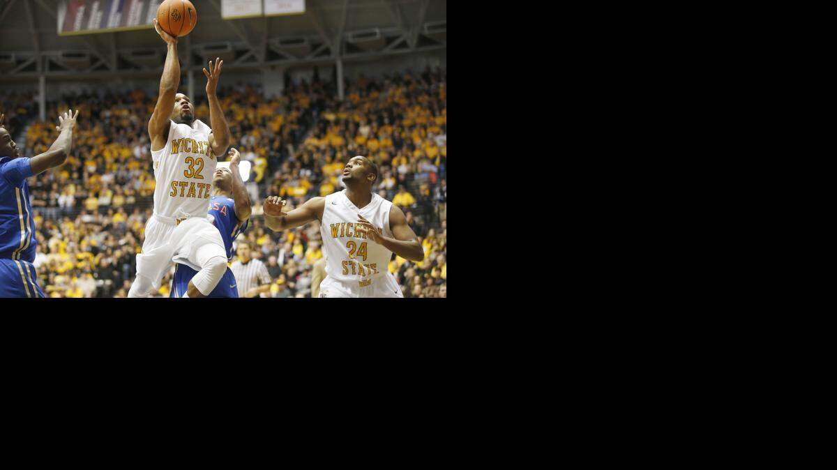 
Wichita State’s Tekele Cotton drives to the basket in the second half against Tulsa. WSU beat Tulsa 75-55. 
