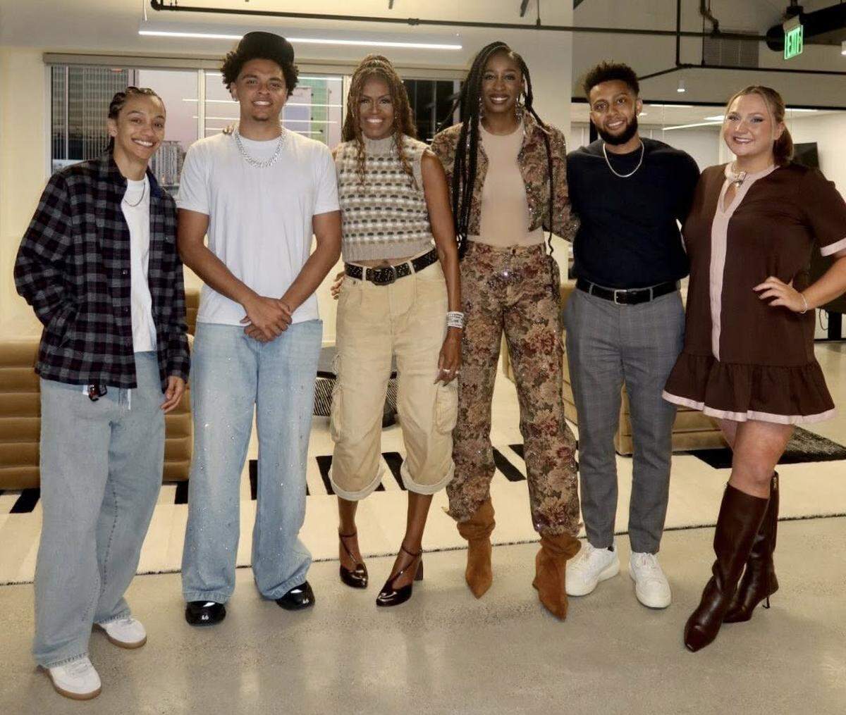 Maize South graduate Aliyah Funschelle (right) was recently invited to meet with former First Lady Michelle Obama (middle) for a brand collaboration.