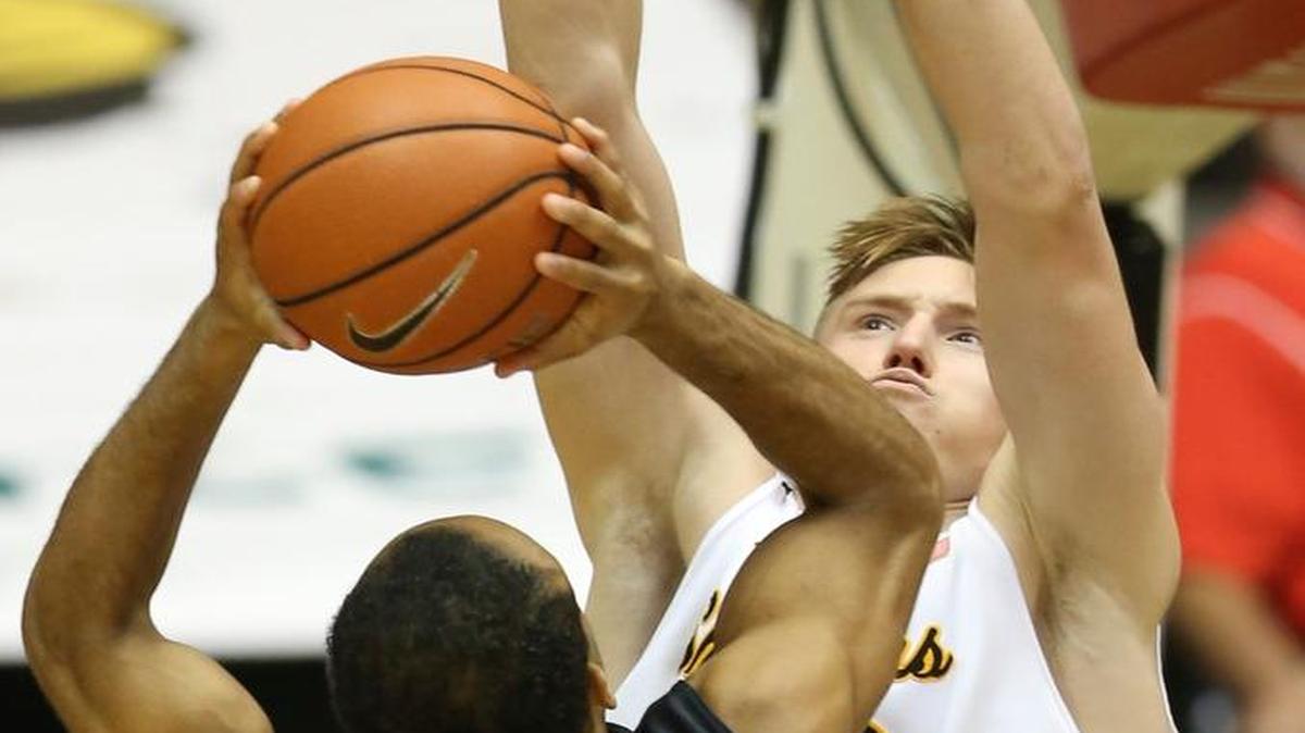 Wichita State center Rauno Nurger is an imposing defender with a strong 6-foot-10 body and arms upraised.