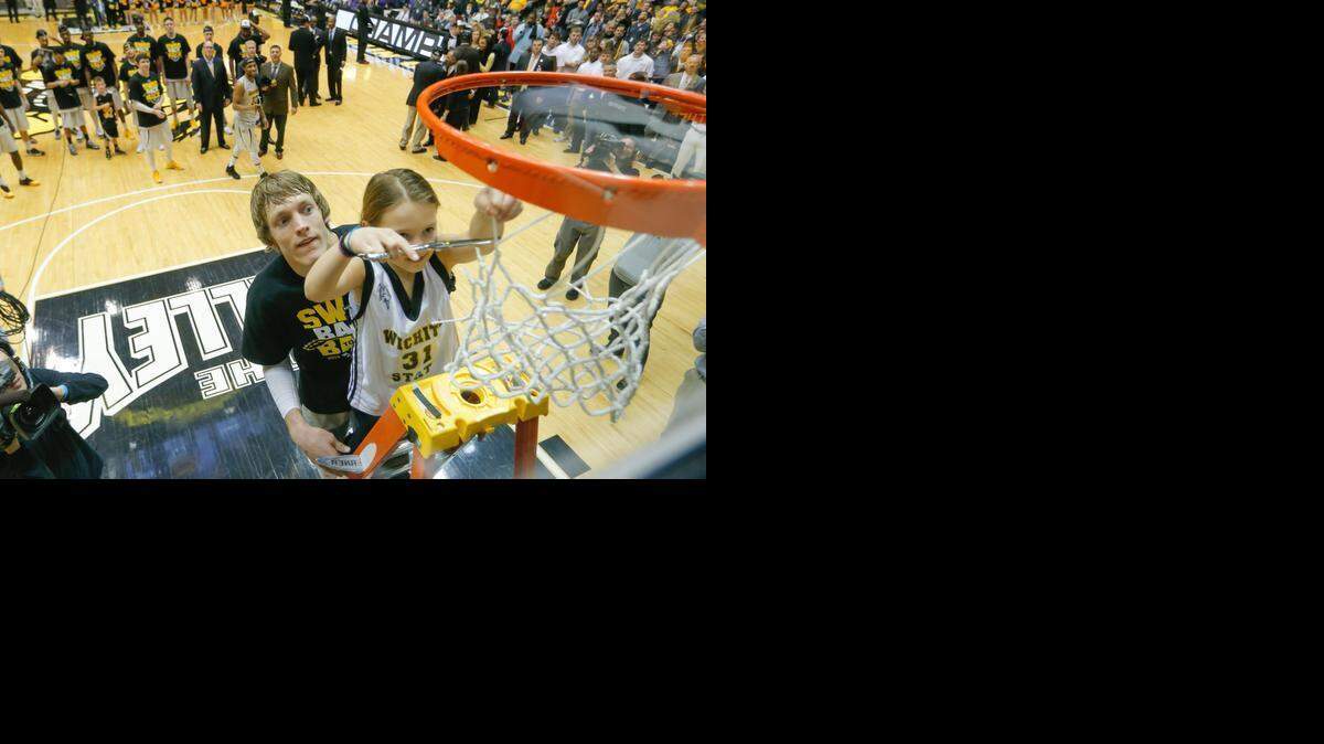 
Wichita State guard Ron Baker pulled this young girl out of the crowd in February to help him cut down the net after the Shockers won the Missouri Valley Conference title.
