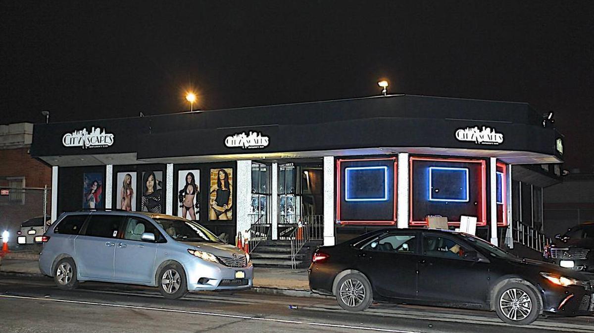 Police investigate the scene where New York Knicks forward Cleanthony Early was shot and robbed at gunpoint early Wednesday morning while in a taxi, leaving a club in Queens.