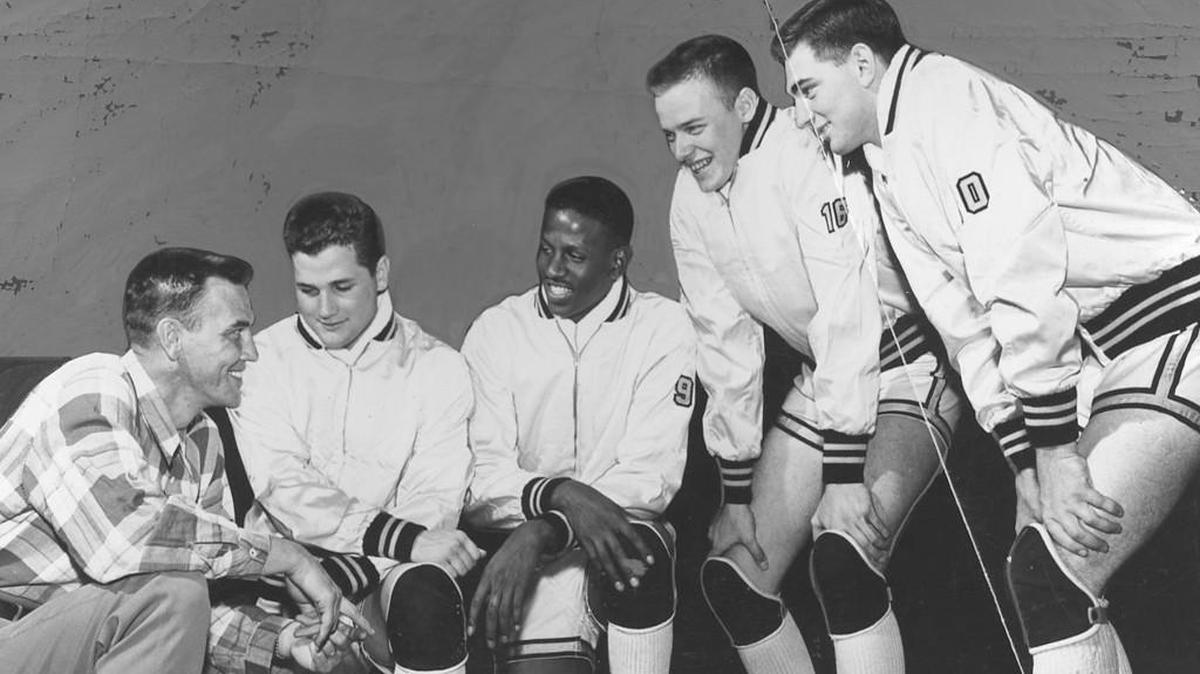 University of Wichita coach Ralph Miller poses prior to the 1952-53 opener with four homegrown Shockers: From left, Gary Thompson, Cleo Littleton, Paul Scheer and Sherrill Compton. Shocker basketball began to take off in the 1950s with Miller at the helm and Littleton as the star player. WU was in its early years with the Missouri Valley Conference.