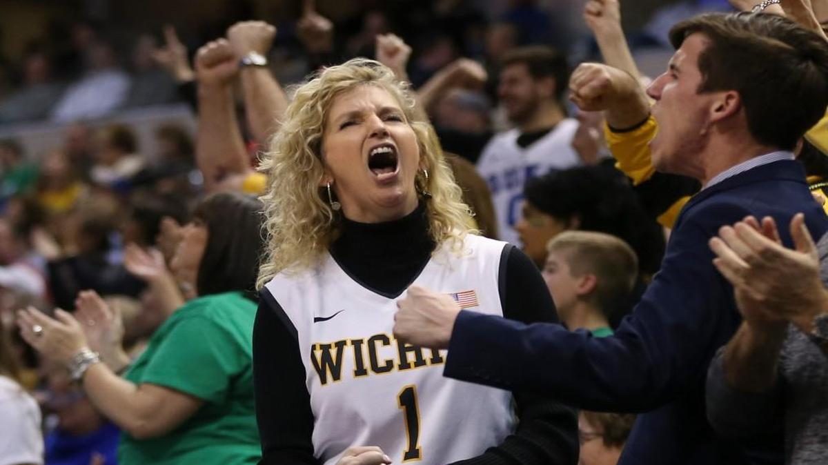 Lynn Marshall, wife of Wichita State coach Gregg Marshall, yells durin the second half of WSU’s win over Dayton on Friday night in Indianapolis.
