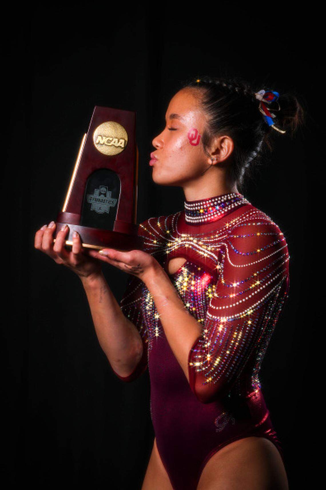 Augusta native Keira Wells poses with national championship trophy for winning the vault at the Women’s Gymnastics Championship.