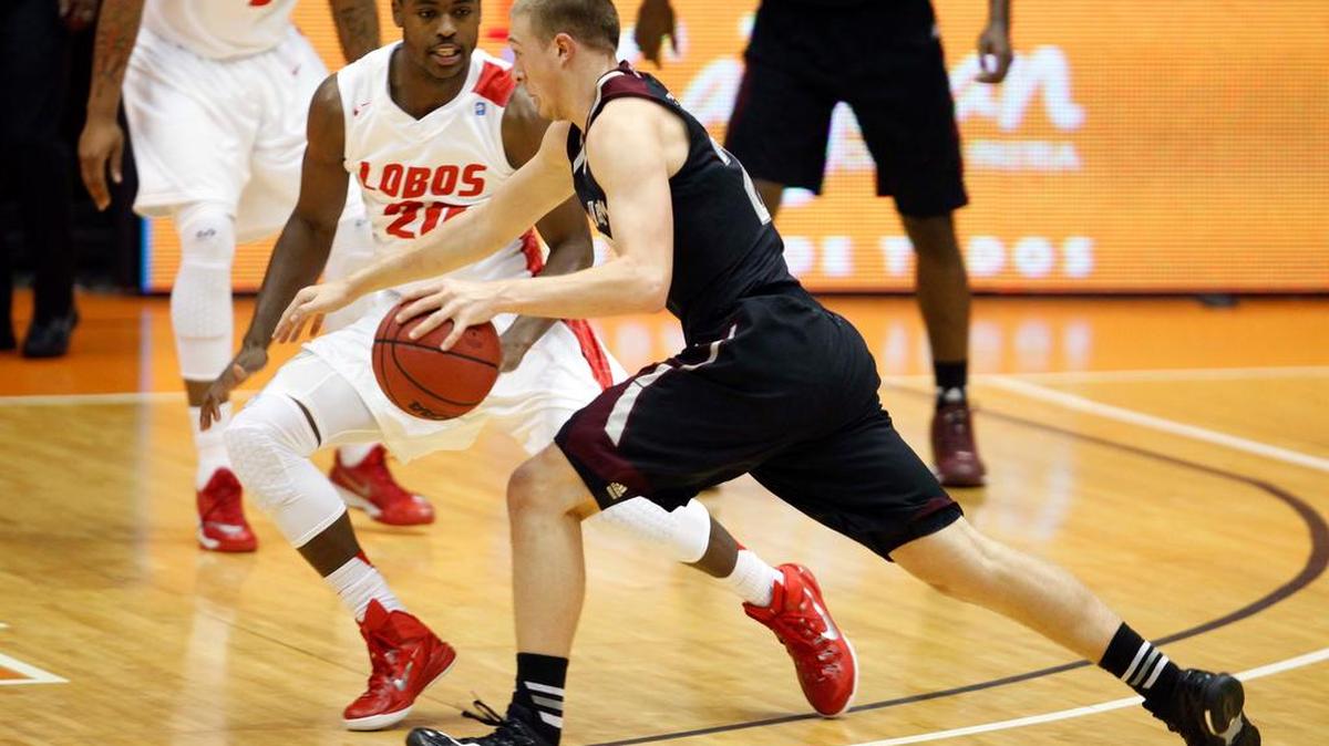 
New Mexico guard Sam Logwood, left, pressures Texas A&M guard Peyton Allen during a NCAA college basketball game in San Juan, Puerto Rico in November.
