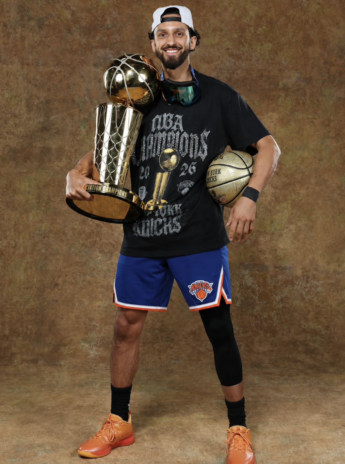 Former Wichita State star Landry Shamet holds the Larry O’Brien Trophy after helping the New York Knicks win the NBA championship on Saturday night.