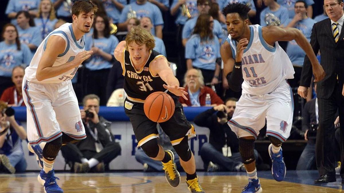 Wichita State's Ron Baker steals the ball from Indiana State's Niels Bunschoten, left, as Devonte Brown follows during the Shockers' 84-51 win on Sunday in Terre Haute, Ind.
