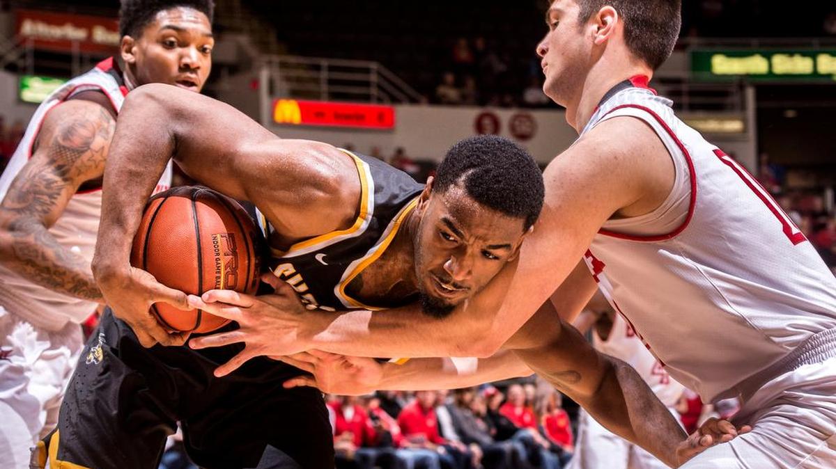 Bradley forward Peter Hanley (14) tries to steal the ball from Wichita State forward Rashard Kelly on Sunday afternoon in Peoria, Ill.