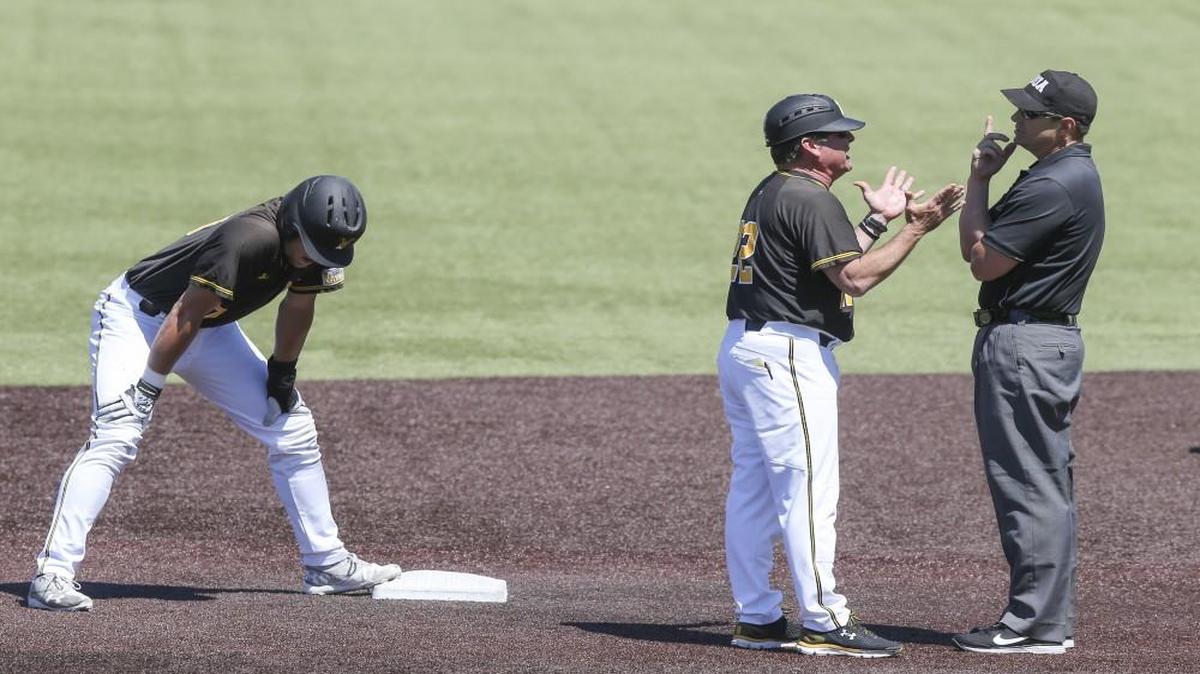 Wichita State coach Todd Butler argues with first base umpire Matt Anderson after Anderson called out Greyson Jenista during the third inning against Evansville on Saturday at Eck Stadium.