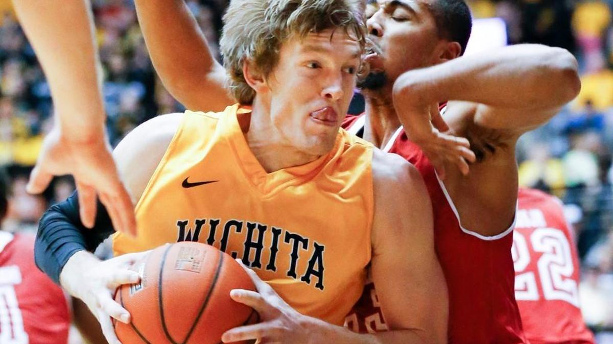 Wichita State's Ron Baker drives to the basket against Bradley's Dwayne Lautier-Ogunleye in the second half at Koch Arena Saturday.
