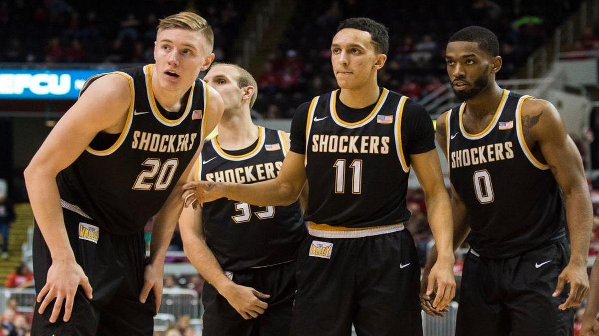 Wichita State's Rauno Nurger, Conner Frankamp, Landry Shamet and Rashard Kelly listen to coach Gregg Marshall during a break in action of Wichita State's 64-49 win over the Bradley Braves on Sunday. (Jan. 29, 2017)