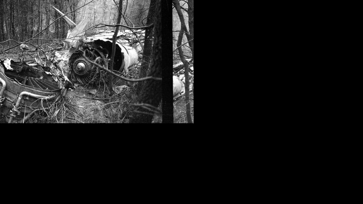 
Parts of the engine from the Marshall University football team plane are scattered in the woods after the crash at the Tri-State Airport in Kenova, W. Va. on Nov. 14, 1970. The crash killed 75 people including players, coaches, administrators and fans. 
