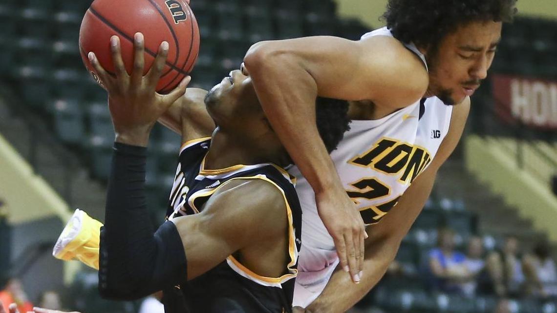 Wichita State Shockers forward Markis McDuffie is fouled by Iowa forward Dom Uhl during the first half of their game at the AdvoCare Invitational in Orlando on Sunday.