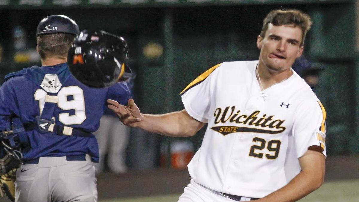 
Wichita State's sam Hilliard crosses the plate to make it 7-6 against Oral Roberts on a Chase Rader single in the bottom of the ninth inning Tuesday at Eck Stadium.
