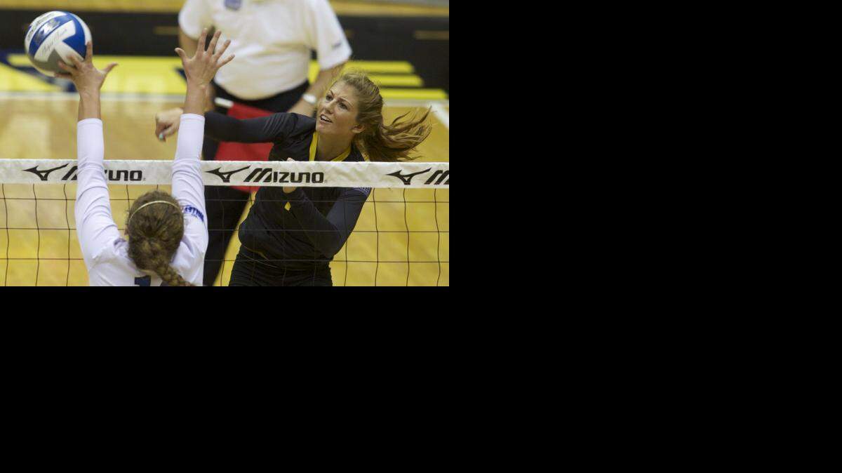 
Wichita State's Ashlyn Driskill hits the ball past Indiana State's Rachel Griffin in September match at Koch Arena.
