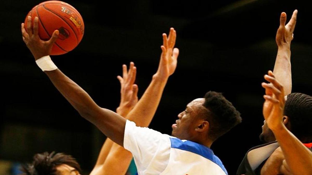 Hutchinson’s Samajae Haynes-Jones shoots against Cowley during a Region VI semifinal in March at Hartman Arena.