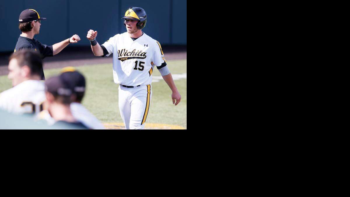 
Wichita State’s Zach Reding is congratulated by a teammate after scoring in the fifth inning against Central Michigan on Sunday.
