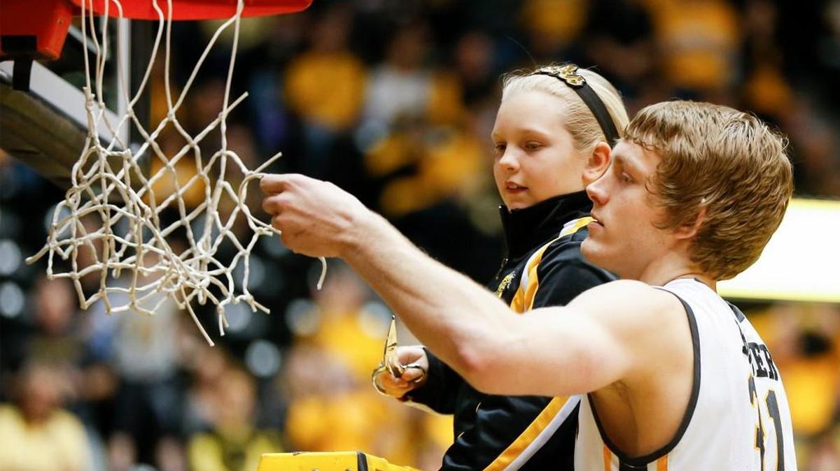Ron Baker and his cousin cut down a net at Koch Arena in February. Men’s basketball was one of nine MVC titles won by the Shockers in 2015-16.