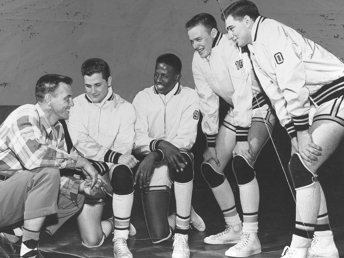 University of Wichita coach Ralph Miller talks with a group of Shocker players before the 1952-53 season opener, including Cleo Littleton, pictured in the middle. Littleton went on to become WSU’s career scoring leader and one of the most important trailblazers in program history.