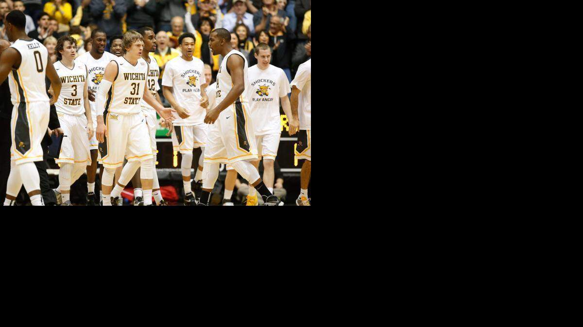 
Wichita State's Ron Baker and the rest of the team get excited after a run in the first half against Seton Hall at Koch Arena. 
