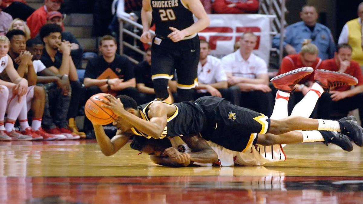 Wichita State guard Daishon Smith, top, and Illinois State guard Paris Lee battle a loose ball during the first half Saturday at in Normal, Ill.