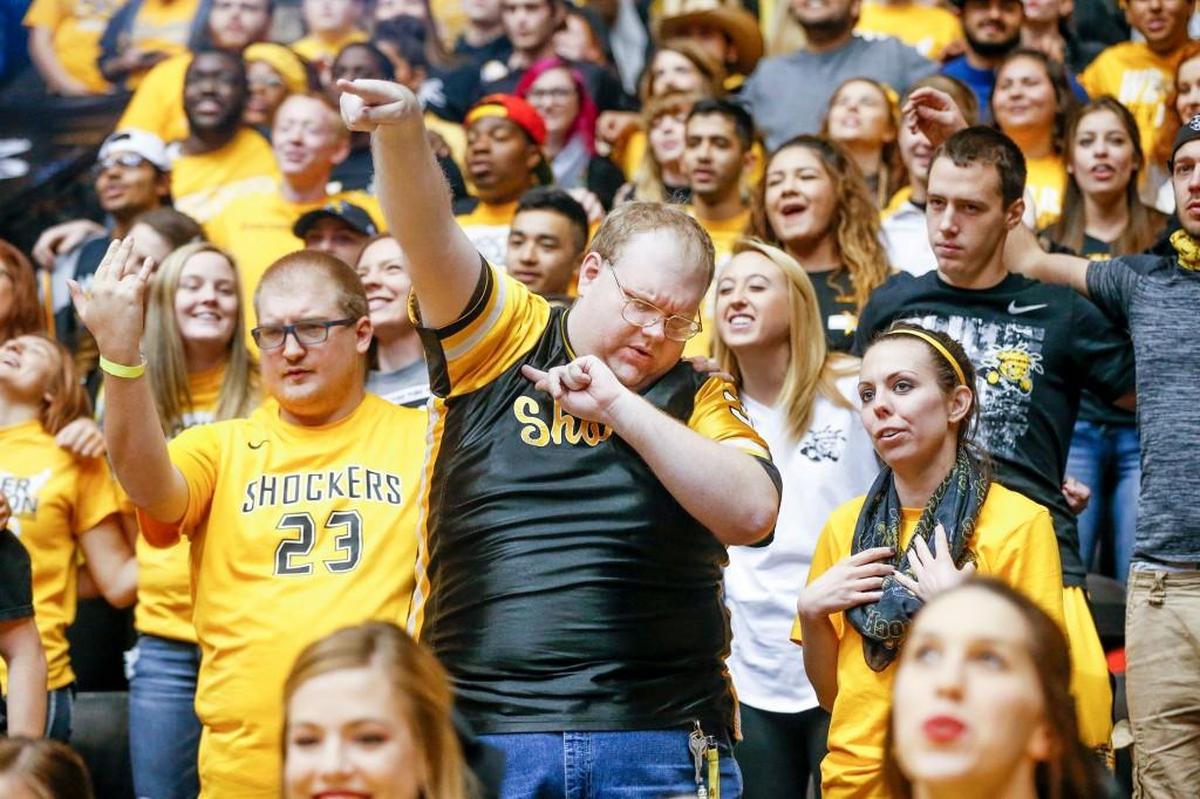 Shocker fan Matt Lester and others cheer before the exhibition game against Hawaii Pacific. Wichita State plays its regular-season opener at Koch Arena on Friday night against Charleston Southern.