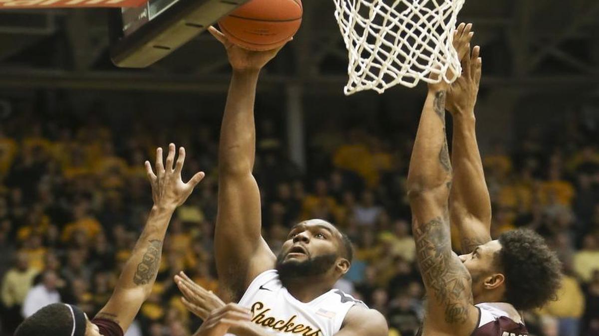 Wichita State’s Shaquille Morris takes a shot against Missouri State’s Dequon Miller, left, and Obediah Church during the first half Thursday night at Koch Arena.