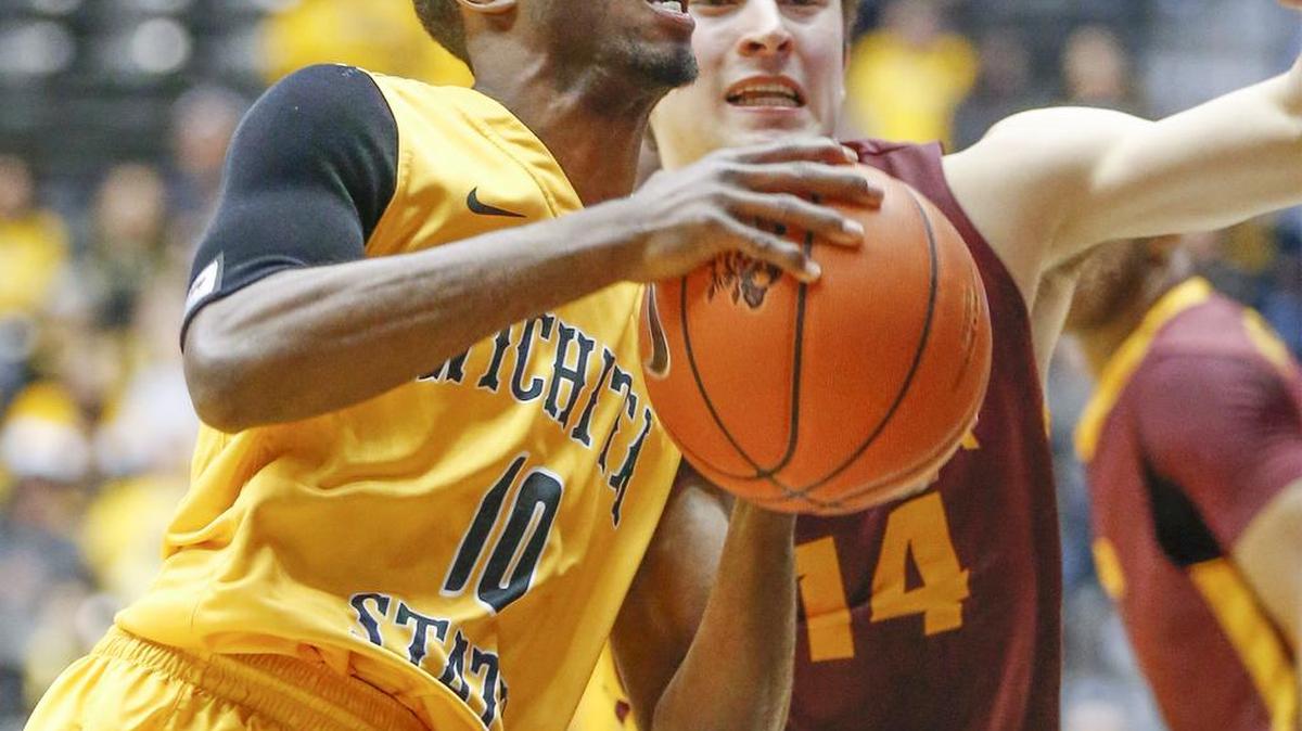 Wichita State's Ty Taylor II (10) drives to the basket against Loyola's Ben Richardson (14) during the first half at Koch Arena Wednesday. (Jan 27, 2016)