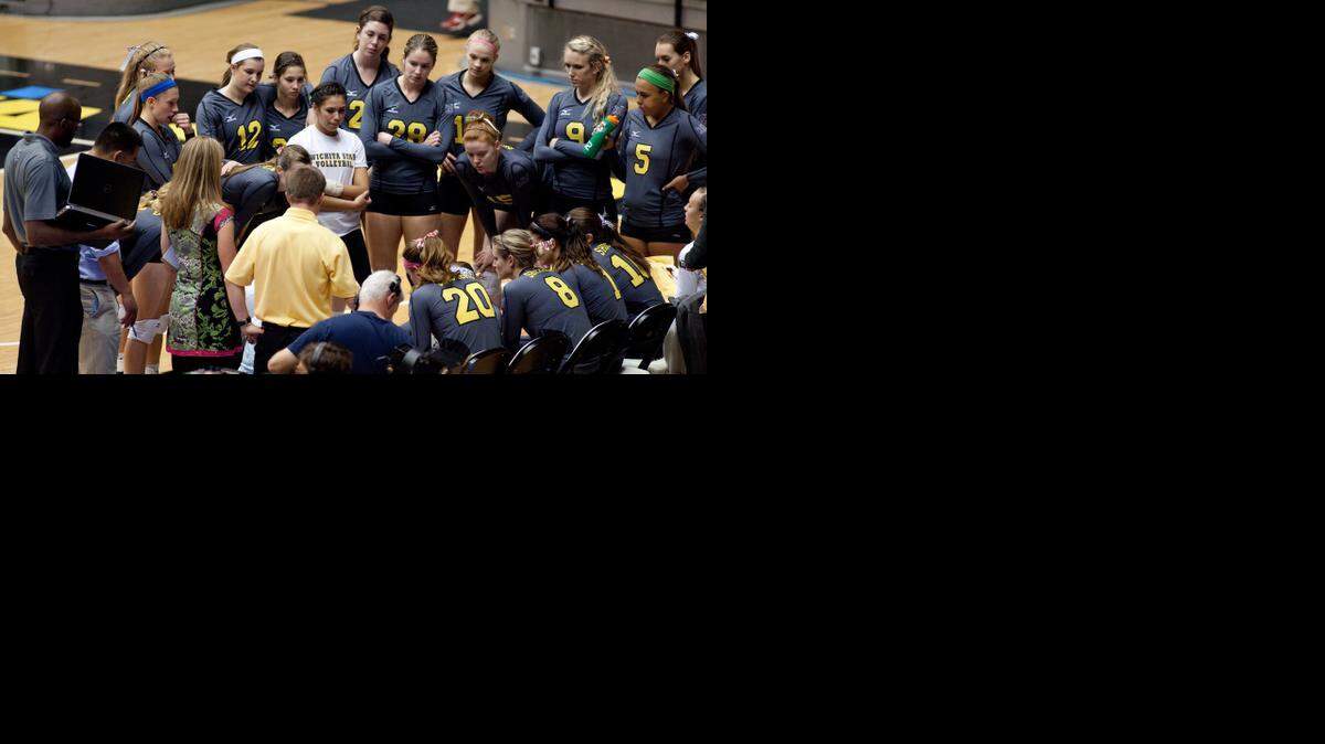 
The Wichita State volleyball team huddles around coach Chris Lamb during a timeout last season.
