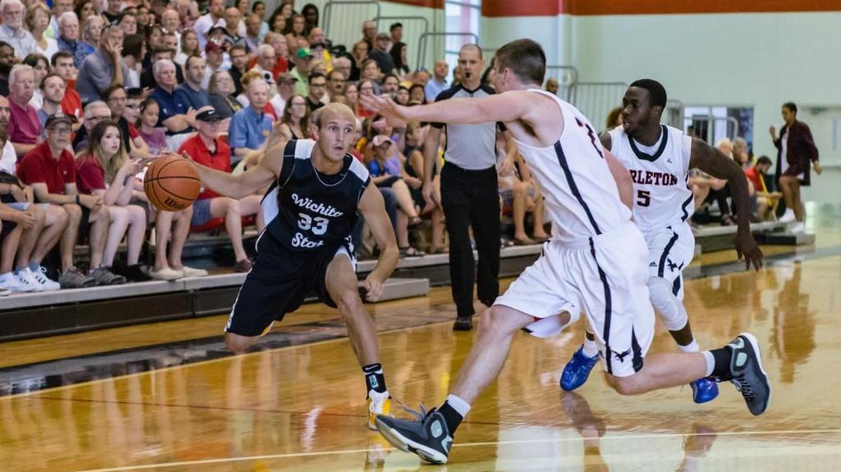 WSU’s Conner Frankamp dribbles against a Carleton double team during Sunday’s 100-75 loss in Ottawa.