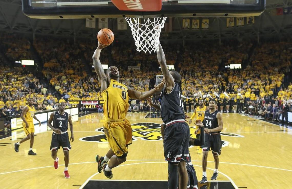 Wichita State’s Rashard Kelly dunks against Cincinnati’s Gary Clark during the second half of a game last season at Koch Arena. Kelly has bigger plans than just being a professional basketball player since graduating from Wichita State.