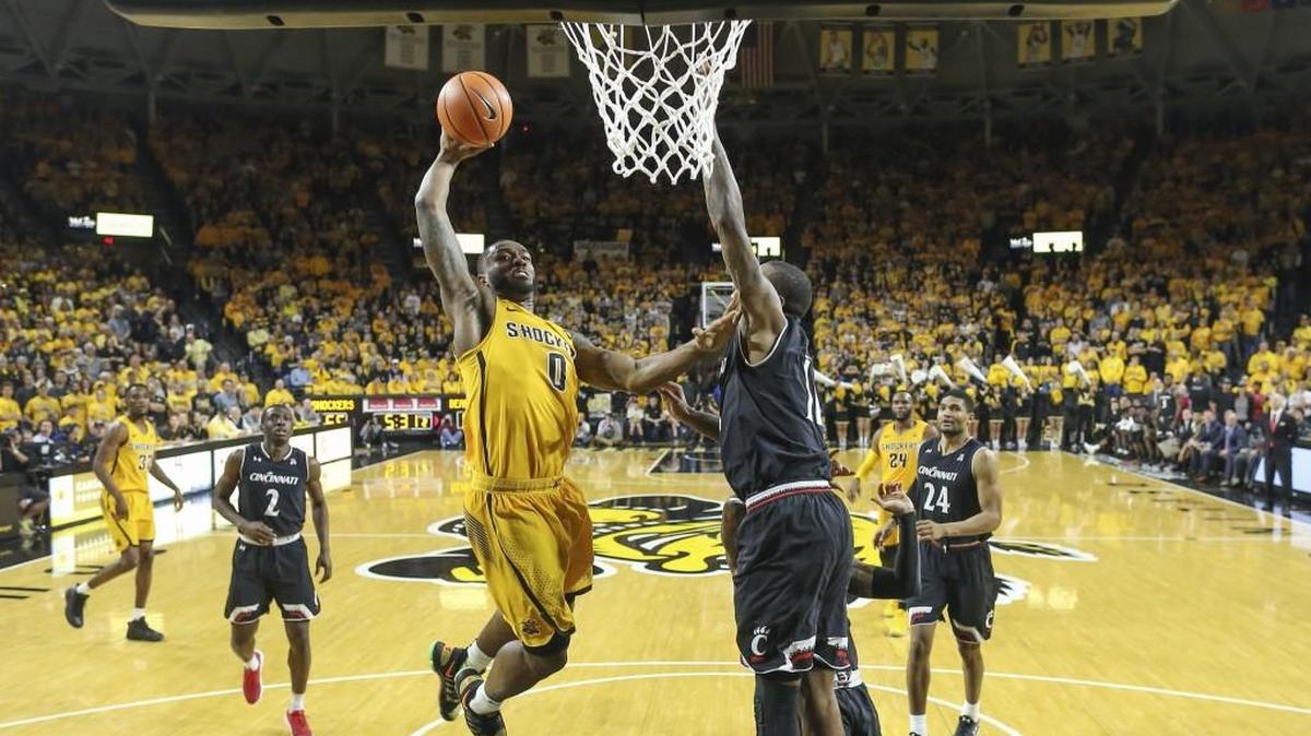 Wichita State’s Rashard Kelly dunks against Cincinnati’s Gary Clark during the second half of a game last season at Koch Arena. Kelly has bigger plans than just being a professional basketball player since graduating from Wichita State.