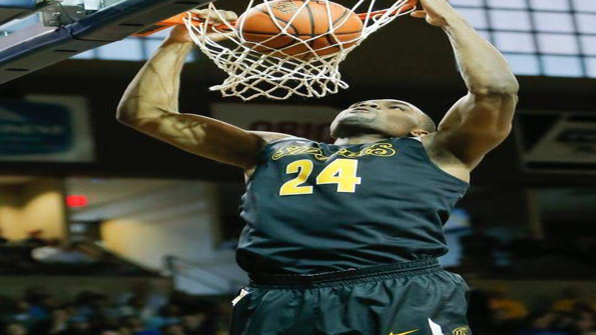
Wichita State's Shaq Morris dunks against Memphis during a game in November.
