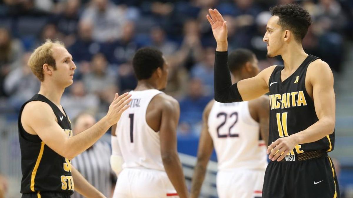 Conner Frankamp, left, and Landry Shamet high-five after Frankamp scored a three-point goal in the final minutes of the game against Connecticut in December at the XL Center in Hartford, Conn.