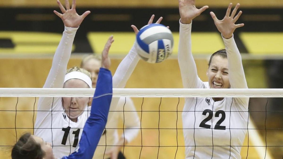 
Wichita State's Abbie Lehman, right, and Jody Larson try to block the shot of Indiana State's Bree Spangler on Friday night at Koch Arena.
