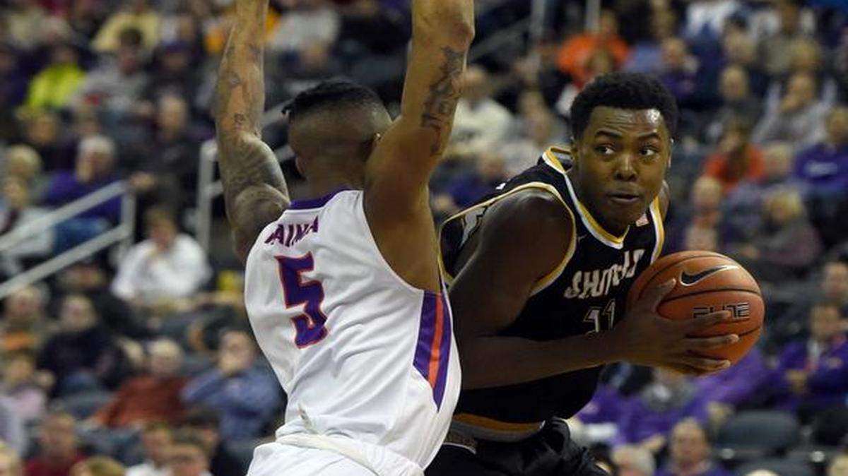 Darral Willis of Wichita State is fouled in the act of shooting by Solomon Hainna of Evansville during the first half in Evansville, Ind., on Tuesday night.