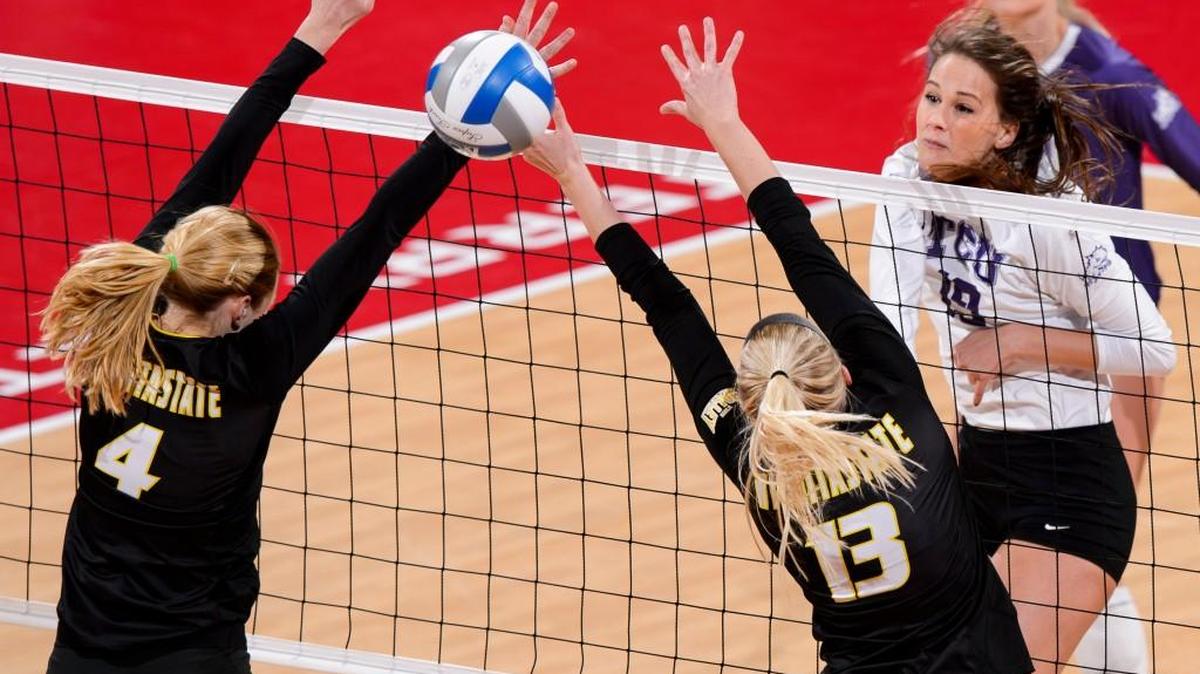 Wichita State middle blocker Katy Dudzinski (4) and setter Emily Hiebert (13) miss blocking an attack from TCU’s Natalie Gower during the second set Friday in Lincoln, Neb.