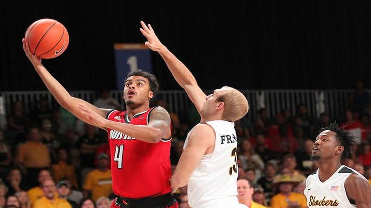 Louisville guard Quentin Snider (4) attempts layup as Wichita State’s Connor Frankamp defends during their game Wednesday at the Battle 4 Atlantis tournament at Atlantis, Paradise Island in The Bahamas.