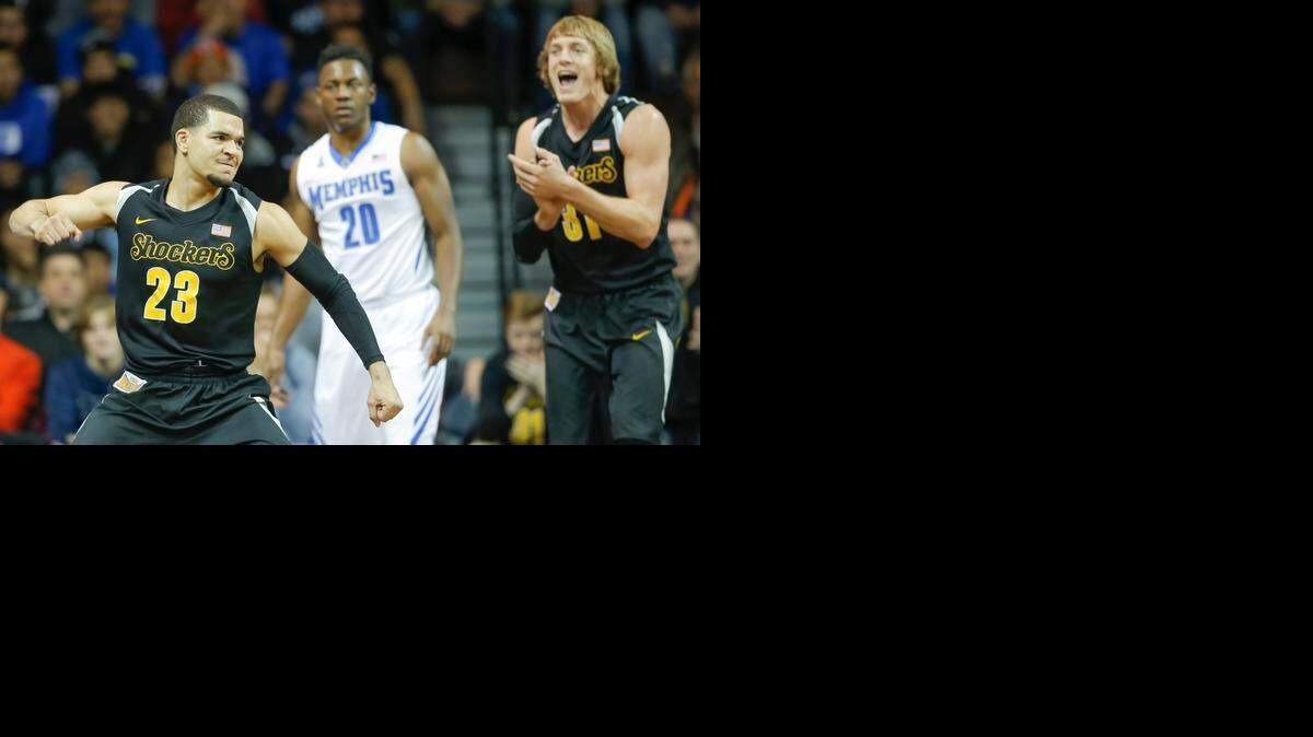 
Wichita State's Fred VanVleet pumps his fist after forcing a turnover against Memphis while teammate Ron Baker applauds his effort against Memphis in November.
