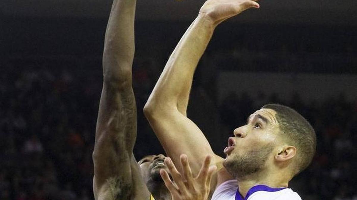 Wichita State’s Zach Brown blocks a shot by D.J. Balentine during Sunday’s game at Ford Center.
