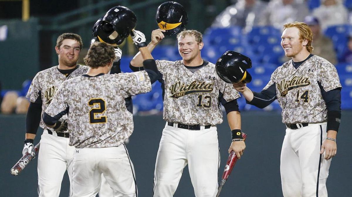 
Wichita State'sTanner Kirk gets congratulated by teammates Keenan Eaton, left, Chase Radar and Gunnar Troutwine after Kirk's three-run homer in the sixth inning Tueday at Eck Stadium.
