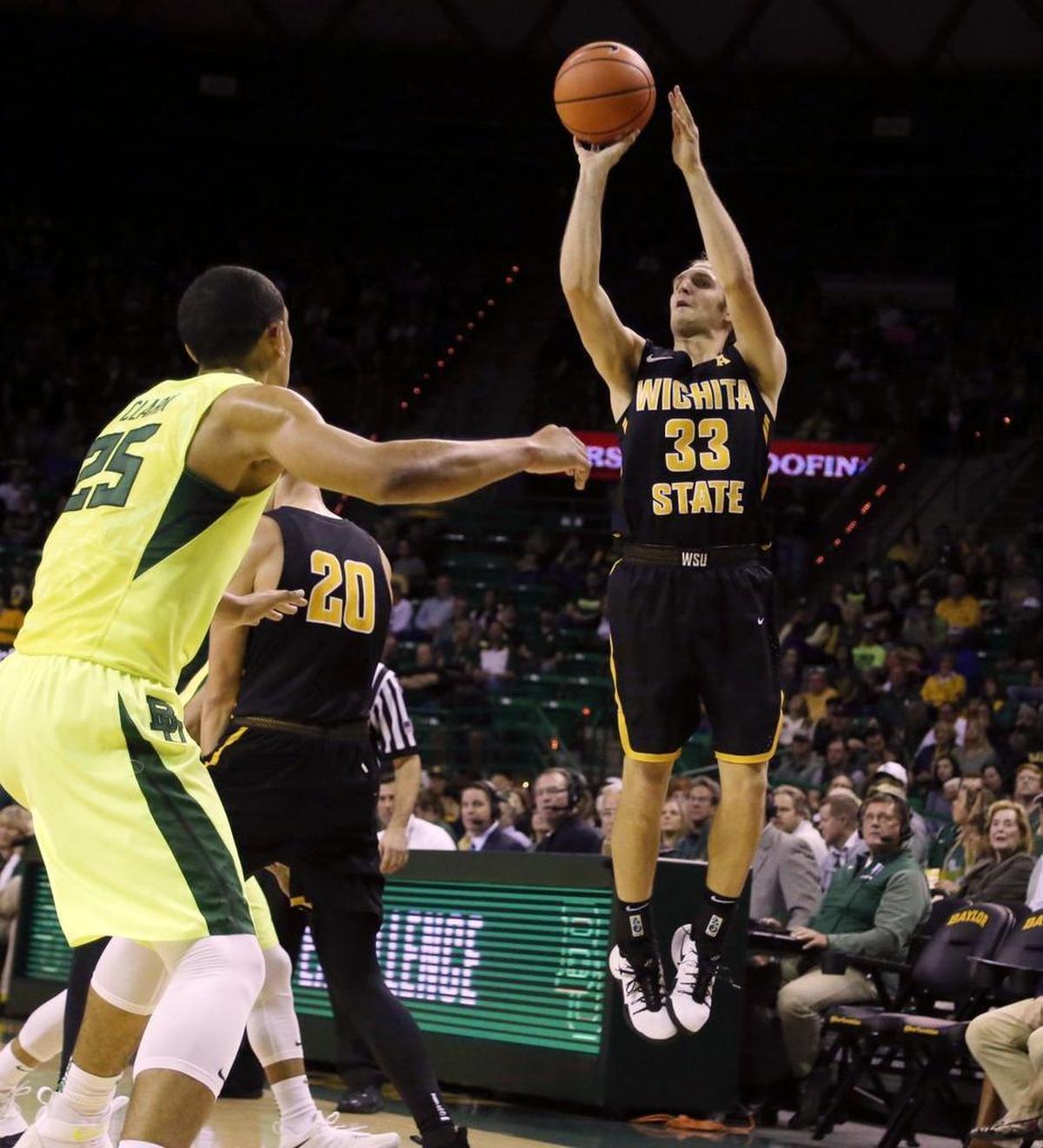 Wichita State guard Conner Frankamp, right, scores over Baylor forward Tristan Clark in the first half Saturday in Waco, Texas.