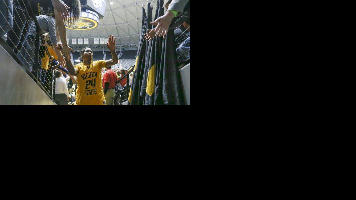 
Wichita State's Alex Harden high-fives fans after a December victory.
