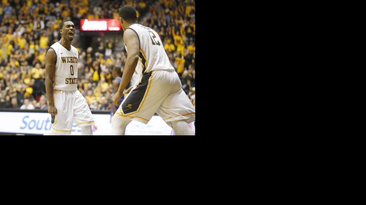 
Wichita State's Rashard Kelly cheers for Darius Carter, right, after Carter’s made a put-back dunk during the second half Tuesday night at Koch Arena. Carter had 16 points and 12 rebounds in the Shockers’ win.
