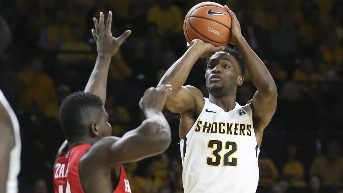Wichita State forward Markis McDuffie shoots a three-pointer over Houston forward Cedrick Alley Jr. during the first half of their game at Koch Arena on Jan. 4.