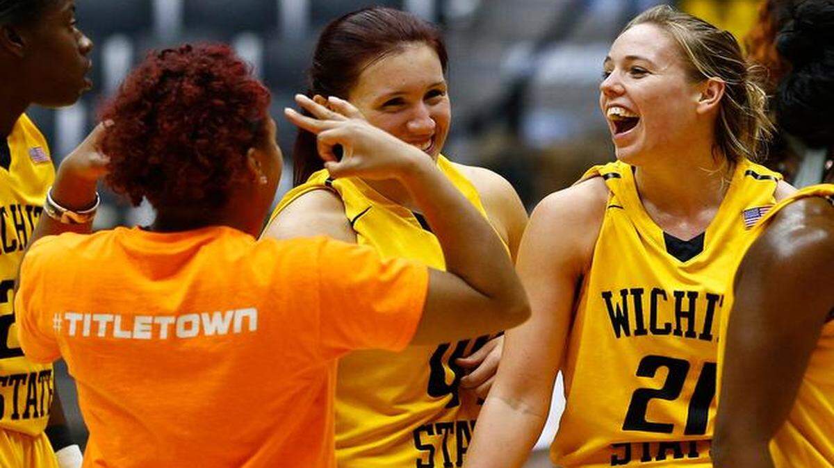 
Wichita State's Alie Decker, right, laughs with teammates after Saturday afternoon’s game at Koch Arena. Decker made nine three-point shots against Winthrop and scored a game-high 31 points.
