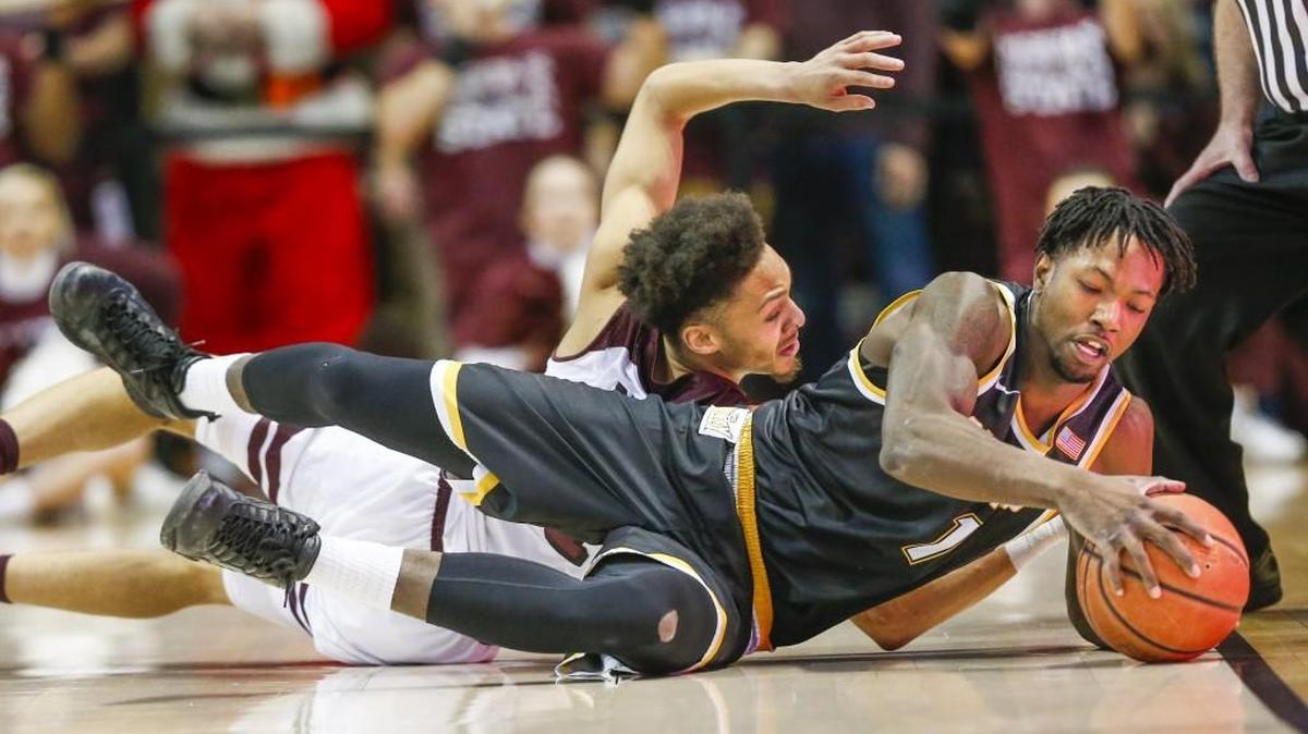 Wichita State forward Zach Brown fights for a loose ball with Missouri State guard Jarred Dixon during the first half.