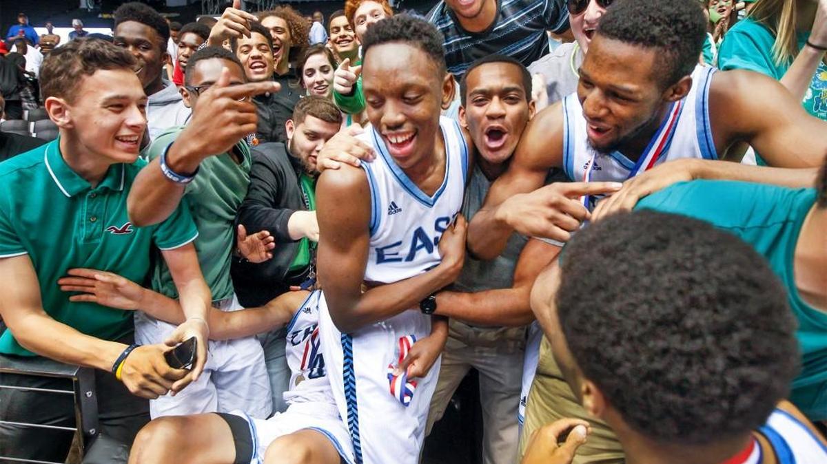 Samajae Haynes-Jones, center, and teammates celebrate with the East student section after winning the 2015 Class 6A title in Koch Arena, where Haynes-Jones will be a Shocker in a year.